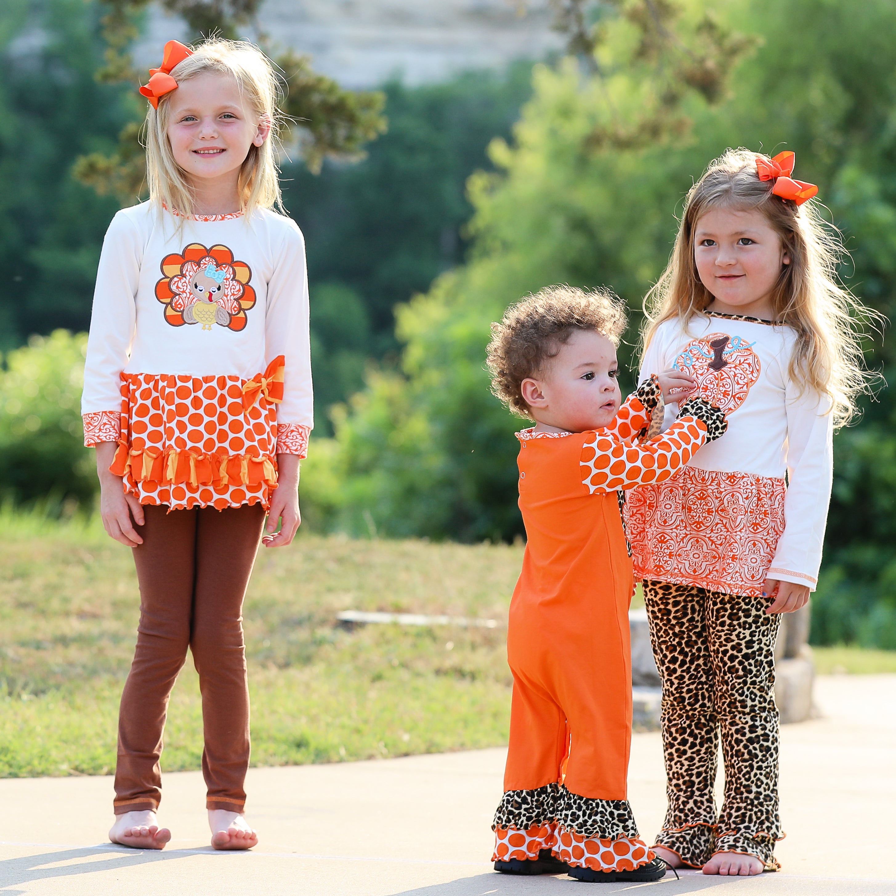 AnnLoren Big Little Girls Autumn Turkey Tunic & Leggings featuring a turkey applique, cream tunic, and orange knit leggings.